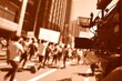 © Achirawee - Cinematic 3D: old film camera filming a revolutionary rally, sepia lighting, side panel blank for title