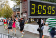 © Rene de Haan/Stocksy - clock and marathon runners