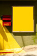 © Tatyana Lavrova/Stocksy - Frame with copy space on a yellow wall and a red mailbox in sunny spot