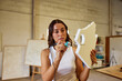 © Javier Díez/Stocksy - Woman creating artistic design in workshop space