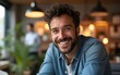 © Christopher - A vibrant image of a cheerful man smiling in a contemporary workspace, embodying positivity and collaboration in a creative environment filled with warm lighting. High quality