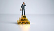 © AucArtStudio - Binoculars vision future business strategy looking search opportunity success focus leader standing gold bar pyramid holding briefcase observing