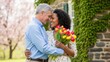 © Tatiana - Smiling older man and woman hugging with tulips. Happy senior couple celebrating love with spring flower bouquet. Romantic relationship and anniversary concept.