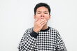 © Ranta Images - Asian Teenage Boy Studio Portrait on White Background Tired Yawning