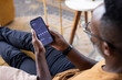 © ReeldealHD images - Man relaxing while checking financial data on phone