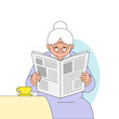 © Marina - Elderly woman reading newspaper while seated at a table with coffee