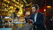 © stockbusters - Lonely man drinking alcohol at bar counter closeup. Upset guy browsing phone