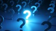 © flashmovie - Bright, glowing question mark standing out in a crowd of dark question marks, representing a brilliant idea, solution, or answer to a problem in a conceptual blue illuminated environment