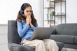 © New Africa - Cyber danger. Frightened girl using laptop at home