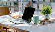 © Graph Squad - Workspace Essentials: A sleek laptop, a calming mug, and a touch of nature converge on a clean desk, inviting focus and inspiration.