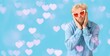 © Pixel-Shot - Cute man wearing heart-shaped glasses on blue background with space for text. Valentine's Day celebration