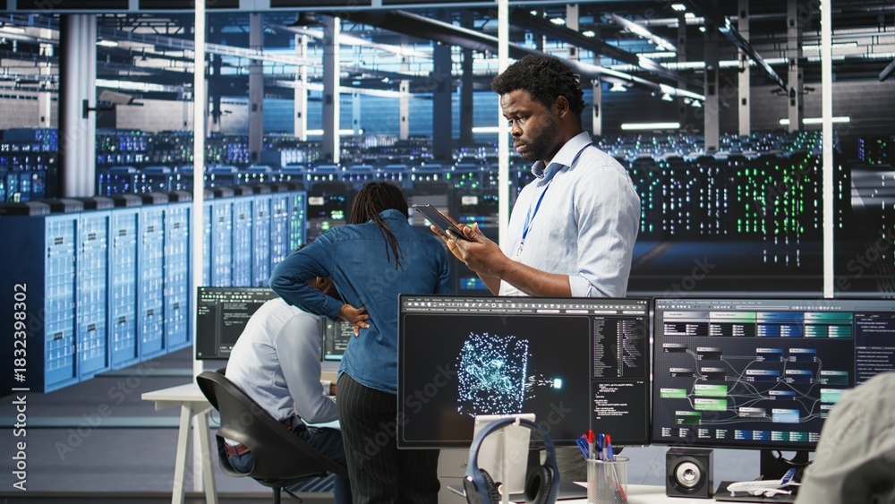 Data center technician using tablet to do node tree programming ...