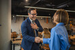 © Miljan Živković - Smiling business colleagues enjoying a casual conversation in the office