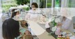 © vectorfusionart - Gathering five women, one wearing sash and headband, chatting at wooden patio table with cupcakes