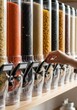 © Bouchra Visuals - Close up of colorful bulk food dispensers in modern zero waste store