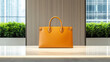 © Panupan - Luxury handbag, leather, yellow, elegant, modern, displayed on marble countertop indoors