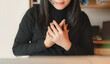 © Anchalee - Close up of woman wearing headset placing hands on chest to express gratitude or empathy. Concept of customer service, emotional support, kindness, communication, and appreciation in business