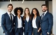 © ye - Happy diverse business team standing in the office. Five cheerful confident successful people in smart casual suits smiling and posing for a group photo all together. Banner. Work and success concept
