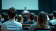 © Stanislau - Students listening to a lecture in a university classroom during daytime session