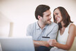 © StigSteex/peopleimages.com - Credit card, love and couple with laptop in home with online payment for bills, account or mortgage. Happy, debit and people on computer for ecommerce shopping together in living room with space.