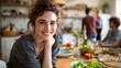 © CStock - A joyful young woman smiles while enjoying a meal with friends, showcasing warmth and connection around the dining table.
