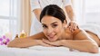 © vvicca - Smiling Woman Receiving Shoulder Massage at Spa Salon