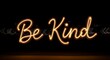 © Rupa - Warm glowing neon sign displaying the positive message be kind in cursive script