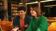 © RZ Images - Young students collaborating on project in university library colleagues working in modern coworking
