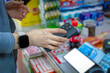 © zhouyilu - Using mobile phone for contactless payment in a store