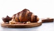 © Derek - chocolate croissant on wooden board with chocolate mousse and chips