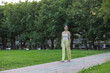 © leungchopan - Young sport woman enjoying morning walk in park