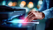 © Aliaksandra - Businessman using a multifunction laser printer at night, tapping on the touchscreen panel in an office environment