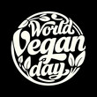 © MST CHIN BANU BEGUM - World Vegan Day cream text emblem with leaves vegetarian