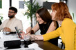 © Nikola Spasenoski - Business meeting in a modern office with team members collaborating on a project, discussing ideas, and sharing insights during the day