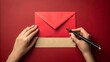 © NoorArt Studio - Hands writing on beige card with red envelope