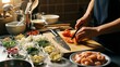© StockShift - Close-up of an Asian adult's hands expertly chopping fresh tomatoes on a wooden board amidst an organized mise en place, preparing a healthy homemade meal in a modern kitchen.