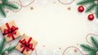 © YULIIA - An elegant arrangement of Christmas gifts, ornaments, and decorations surrounded by festive greenery.