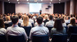 © jendralbiribiri - Engaged audience attentively watching presentation in modern conference hall fostering learning and collaboration