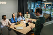 © Miljan Živković - Business team collaborating in a meeting presentation