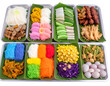 © SulasTree - Assorted traditional Vietnamese dishes arranged in a multi-compartment tray with fresh vegetables and colorful noodles