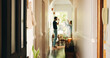 © peopleimages.com - Couple, hallway and home with argument, fight or conflict for disagreement, breakup or divorce. Frustrated, man and woman shouting with dispute in house corridor or passage for cheating affair