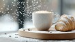© ethan - A cup of coffee and a croissant dusted with powdered sugar sit on a wooden tray. Coffee beans and falling sugar add to the cozy atmosphere.