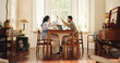 © peopleimages.com - Happy couple, home or laptop with high five for business success or coworking together. Man, woman or remote work with smile, computer or celebration for winning, good news or teamwork in house