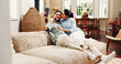 © peopleimages.com - Happy couple, selfie and hug on couch, home and web post with cheek kiss, love or relax in lounge. Woman, man and smile for photography on sofa, profile picture or embrace on social media at house