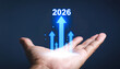 © AucArtStudio - 2026 financial growth chart forecast strategy investment future success finance trend data prosperity rising arrows in palm expressing optimistic business growth and investment confidence