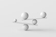 © Cagkan - Balancing act of spheres on seesaws creating equilibrium
