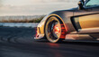 © Murda - Sports car on track with glowing brakes and tire marks