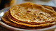 © vefimov - A stack of warm and fluffy Indian flatbreads ready for serving