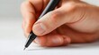 © Abidinawan Design - Hand holding a pen writing on white paper close-up shot for business or education concepts