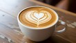 © BABAY - A cup of frothy cappuccino, with a perfect heart-shaped latte art on top.